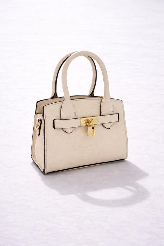 Elegante crème handtas met een tijdloos en stijlvol design.