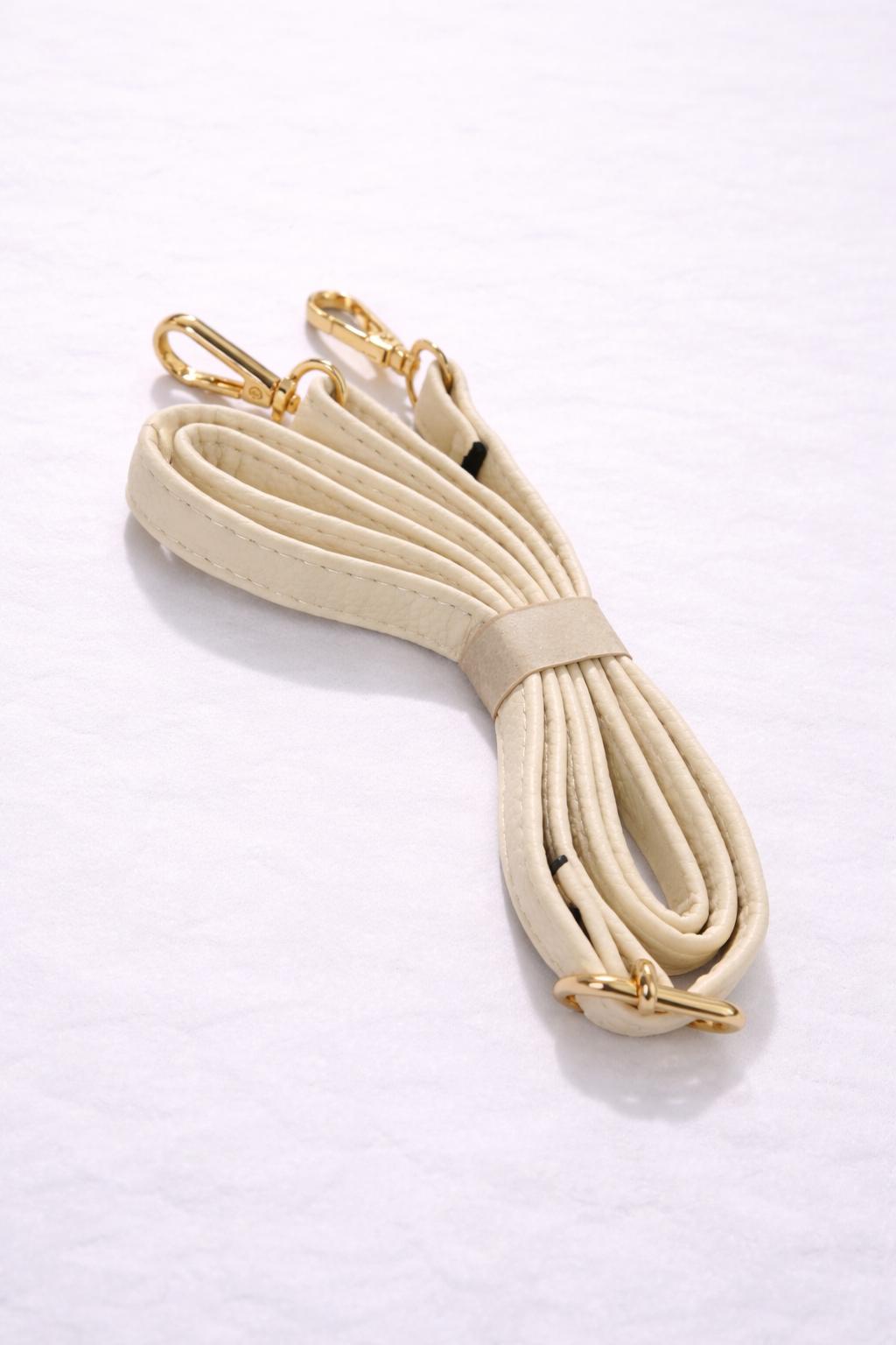 Elegante crème handtas met een tijdloos en stijlvol design.